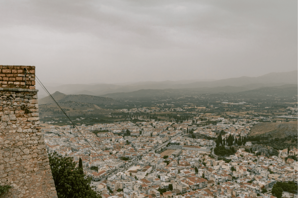 View over Nafplio, Greece, from the Palamidi Fortress on a cloudy day, a popular destination for day trips from Athens.