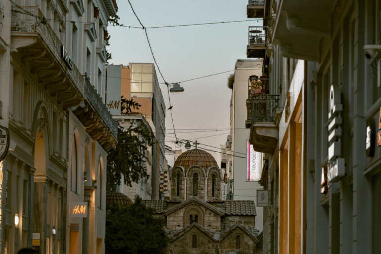 Church of Panagia Kapnikarea surrounded by shops and buildings in central Athens, a blend of ancient history and modern city life for travelers wondering if Athens is worth visiting.