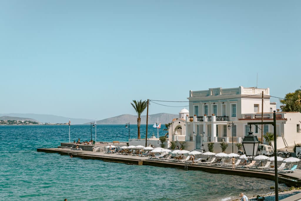 Waterfront in Spetses with turquoise sea and neoclassical building