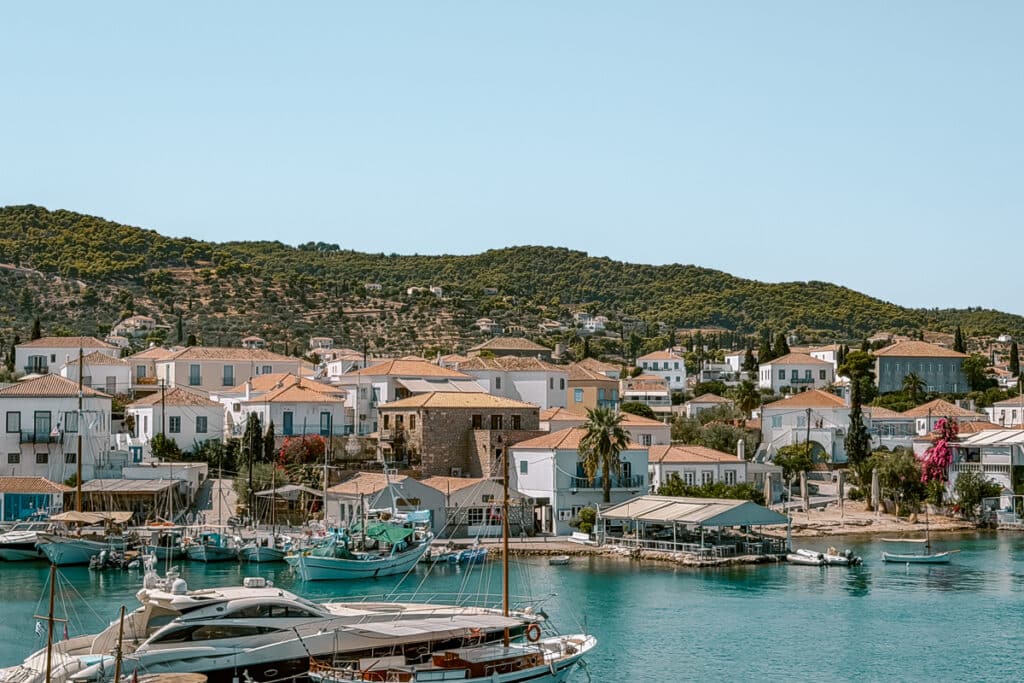 View of Spetses Town harbor with boats and whitewashed buildings