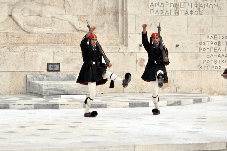 Greek Evzones performing the ceremonial changing of the guard at the Tomb of the Unknown Soldier in Syntagma Square, Athens, Greece.