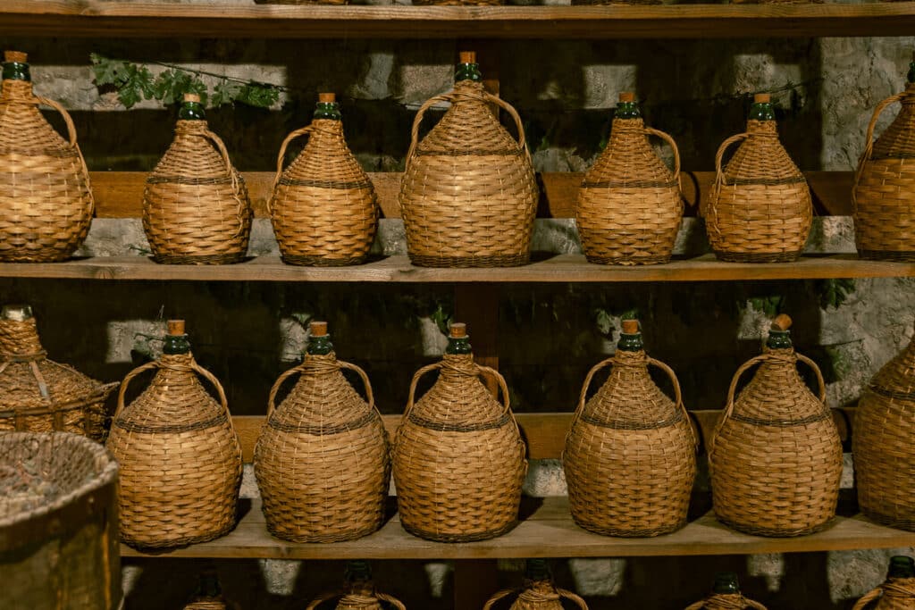 Woven wine baskets sitting on a shelf at one of the monasteries in Meteora.