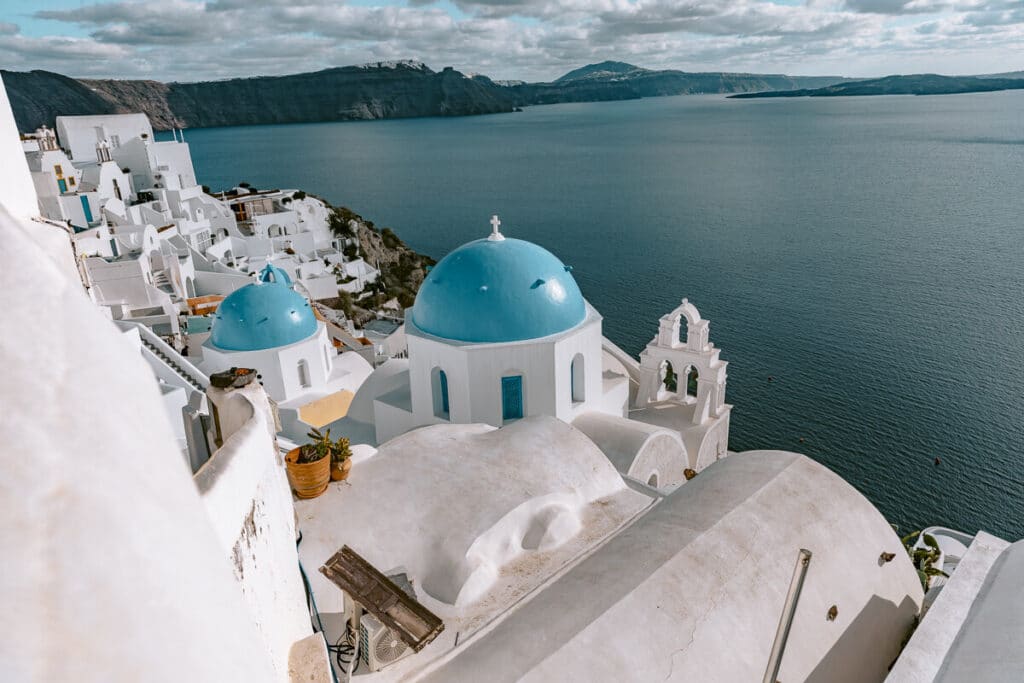 Blue-domed churches overlooking the caldera in Oia, Santorini.