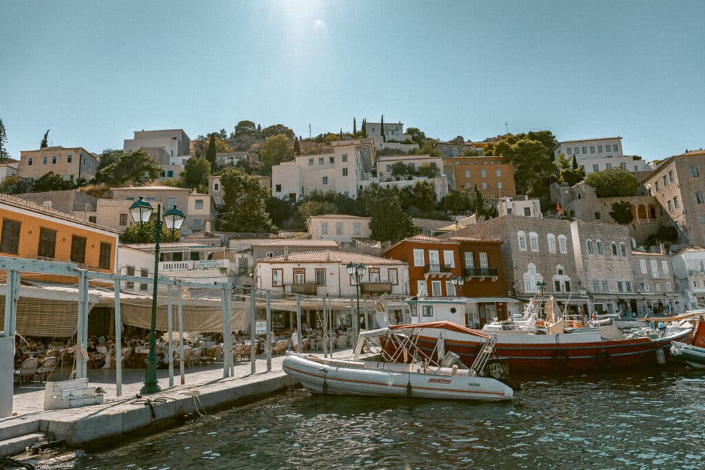 Colorful port of Hydra island with boats docked along the waterfront, a must-visit for solo travel Greece experiences