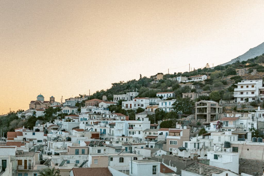 Hillside village on Ikaria island in Greece at sunset.