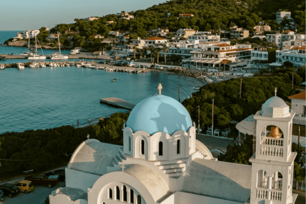 Agistri Greece, a peaceful Greek island for solo female travel, with a blue-domed church and coastal views.
