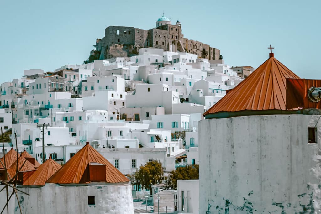 View of Astypalaia’s iconic windmills and Venetian castle — one of the most iconic scenes on any what to do in Astypalaia, Greece itinerary.