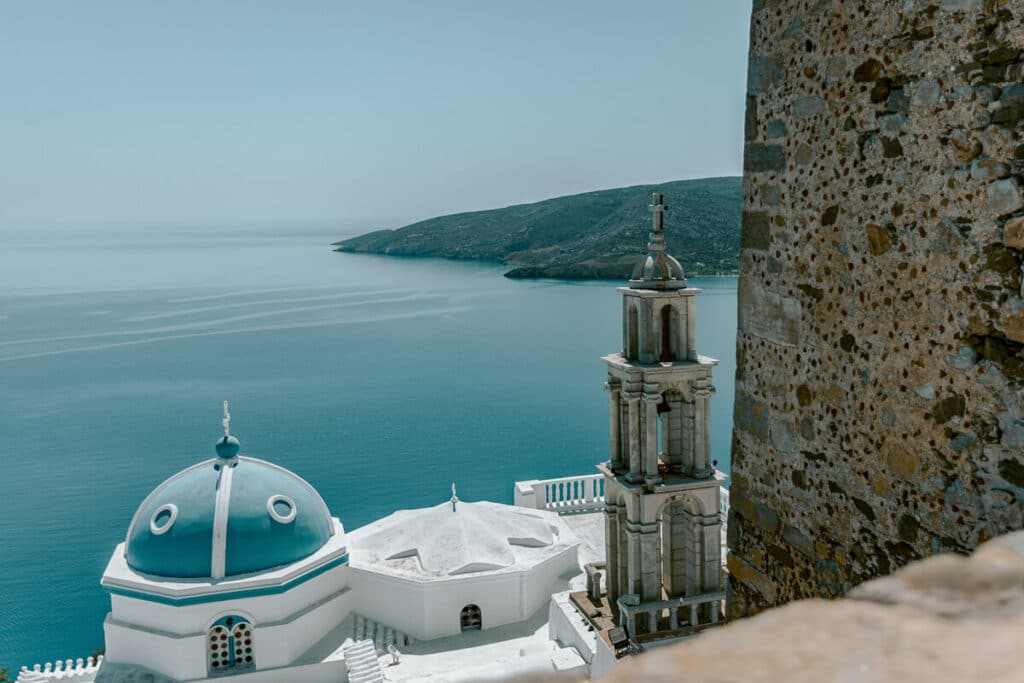 tunning sea view from the castle in Astypalaia, featuring a blue-domed church and bell tower