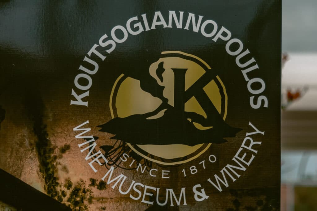 Close-up of Koutsoyannopoulos Wine Museum & Winery sign in Santorini