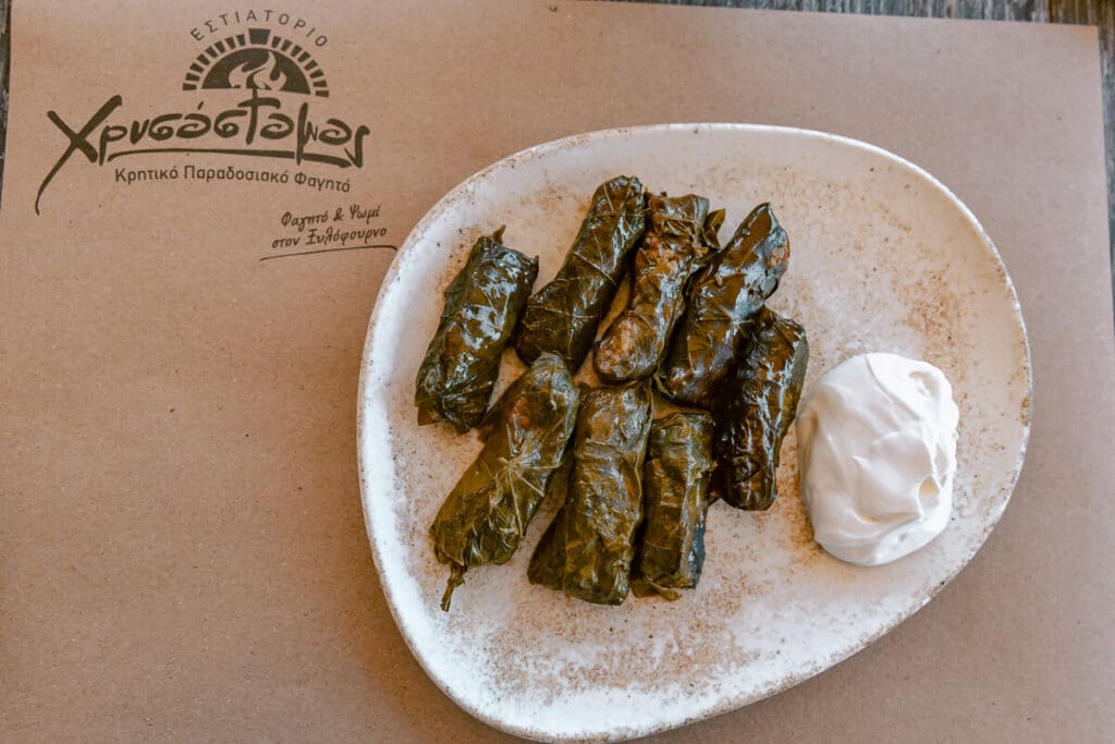 Plate of dolmades with a side of yogurt at Chrisostomos in Chania, one of the memorable food stops from this Crete trip