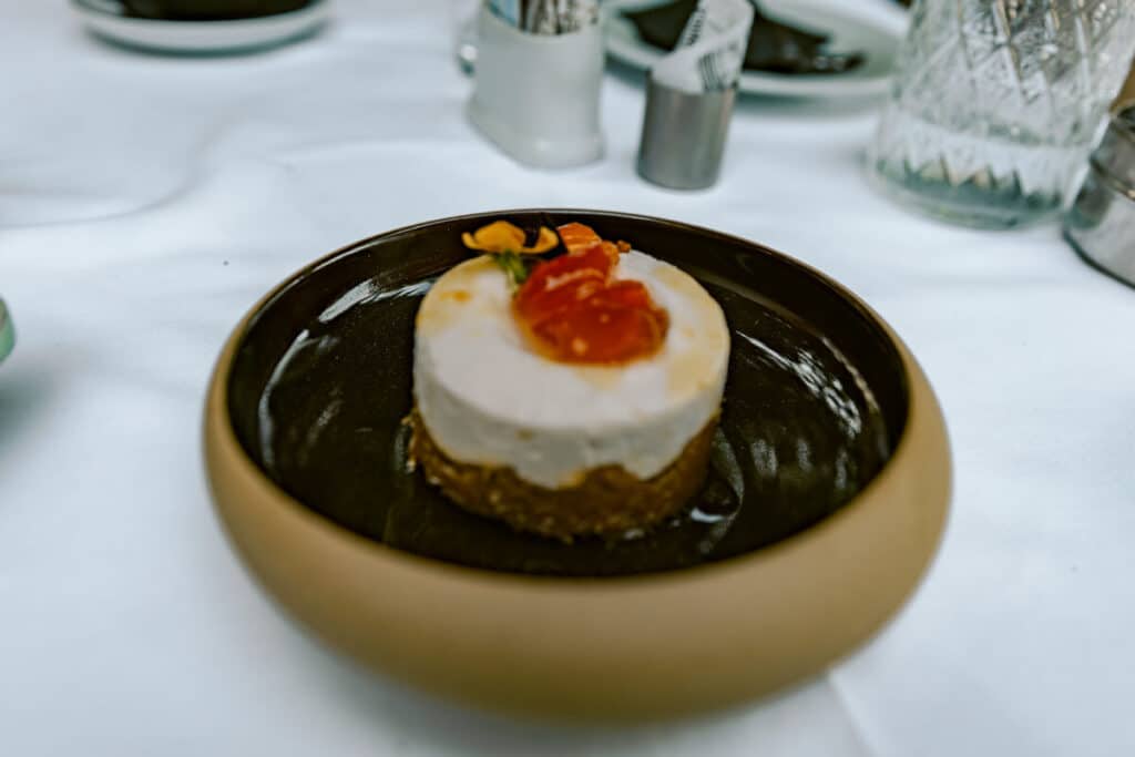Kumquat mousse dessert served in a bowl at a restaurant in Corfu Old Town.