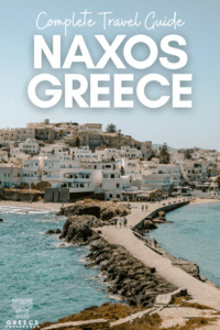 Pinterest graphic for a complete Naxos, Greece travel guide showing Chora’s whitewashed hillside, harbor, rocky walkway, and turquoise sea.