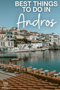 Pinterest pin graphic for a post about the best things to do in Andros, with Batsi harbor in the background and large white text.